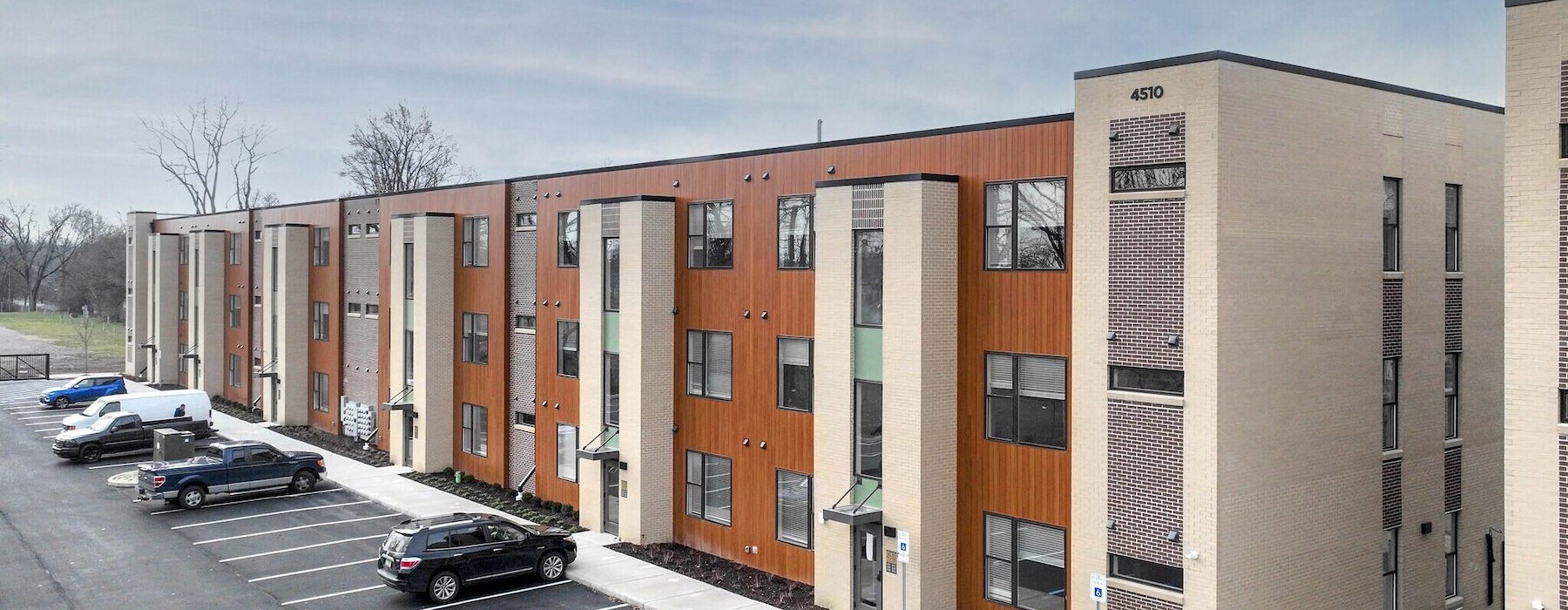 a building with cars parked in front