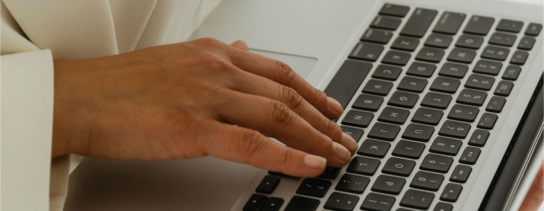 a person typing on a laptop