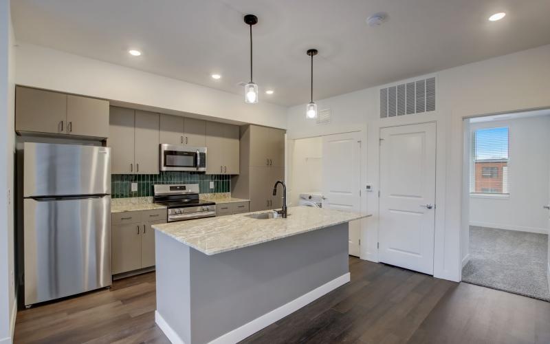 a kitchen with white cabinets
